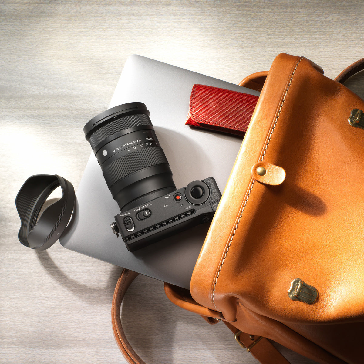 Sigma 16-28 mm F2.8 DG DN Lens for Sony E Mount Bundle with 1TB USB Hard Drive and 64GB Memory Card