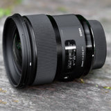 Sigma 24mm F1.4 DG HSM Art Lens with USB Dock, Camera Bag, 64GB Memory Card, and 77mm Filter Bundle