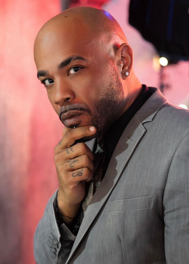 Man in a gray suit with a blurred background