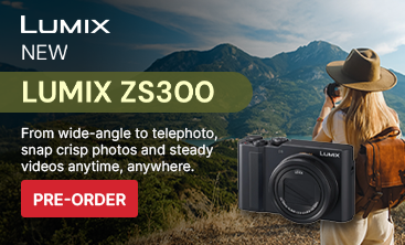 Advertisement for Panasonic LUMIX ZS300 camera with a person taking a photo in the background.