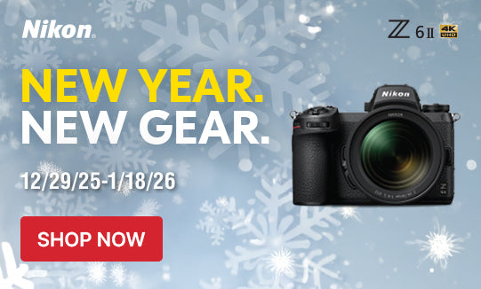 Nikon camera advertisement with snowflake background and 'New Year. New Gear.' text