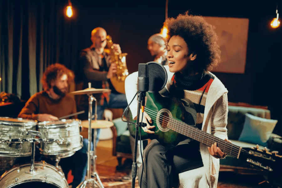 Band performing in recording studion.